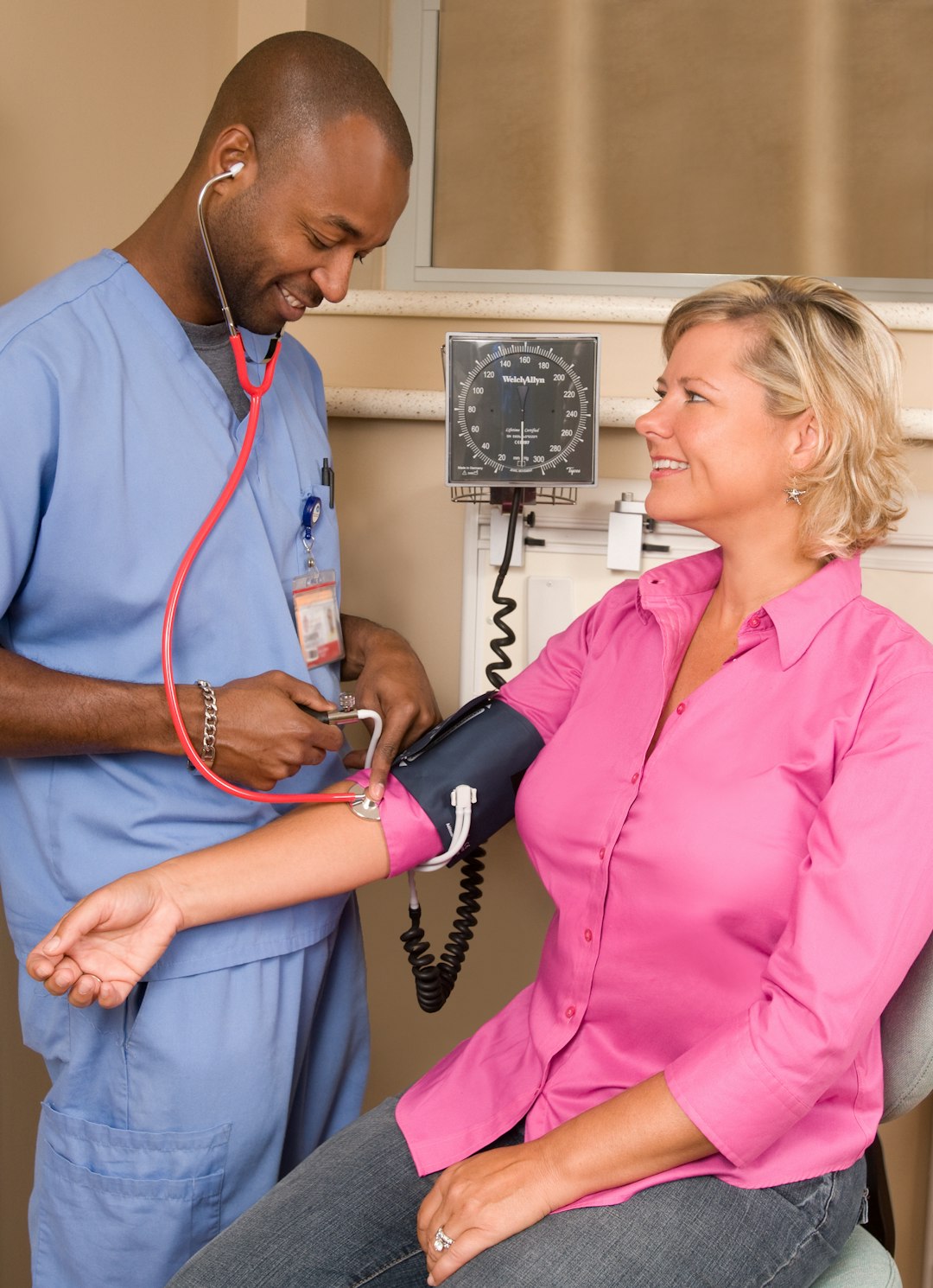 Blood pressure check during a corporate wellness day health screening